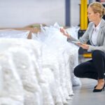 Shot of a female factory manager doing an inspection of raw materials